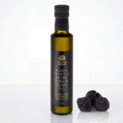 Black Truffle Extra Virgin Olive Oil 250ml by Truffle Theory with fresh whole black truffles on white background.