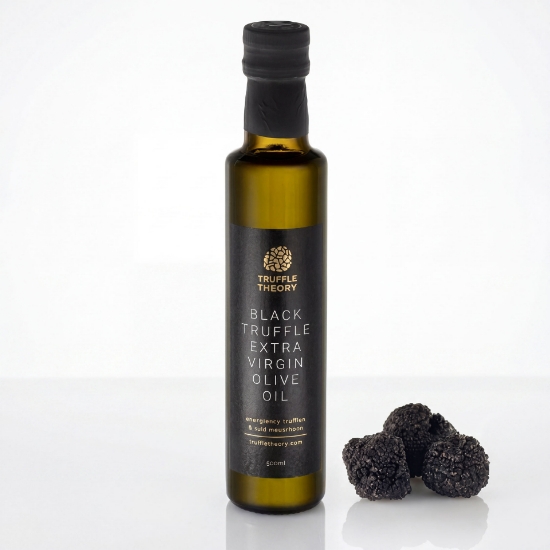 Black Truffle Extra Virgin Olive Oil 250ml by Truffle Theory with fresh whole black truffles on white background.