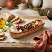 Personalized Olive Wood Rustic Appetizer Plates 35x10cm by Olea Wood in a natural lifestyle setting