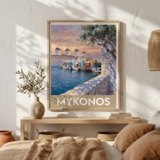 Aurea Mykonos Little Venice travel poster framed in a light oak frame, hanging on a rustic plaster wall within an elegant, qu...