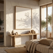 Aurean Hydra Island art print on a rough white plaster wall in a minimalist Greek villa bedroom